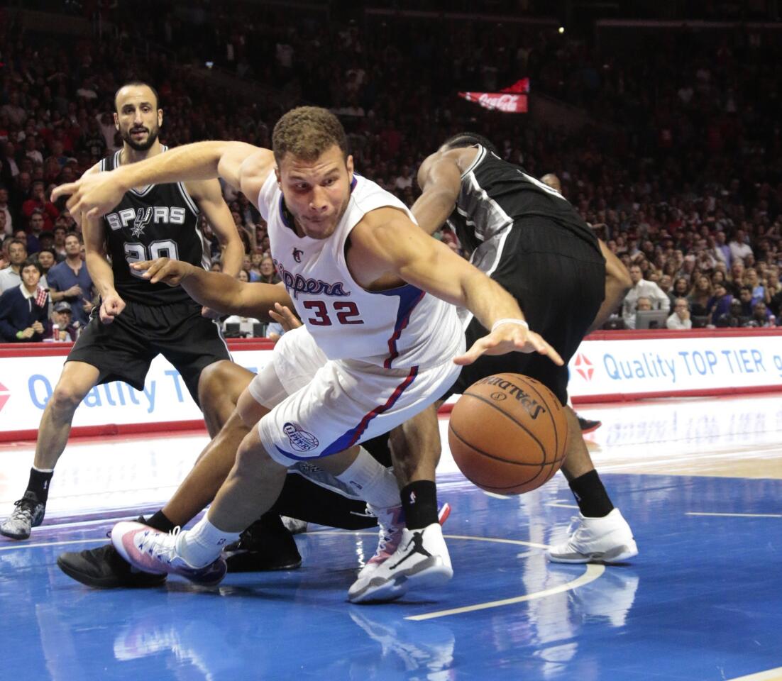 Clippers power forward Blake Griffin tries to gather a missed shot by teammate Chris Paul (not pictured) in the final seconds of the game against the Spurs.