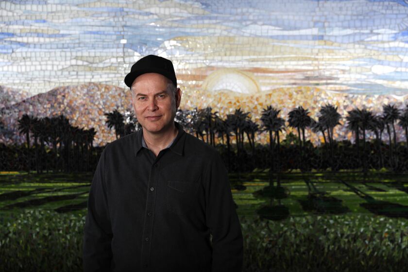 LOS ANGELES, CA-JANUARY 7, 2019: Concert promoter Paul Tollett, the longtime president of Goldenvoice Productions, is photographed in front of a mosaic of the Coachella landscape, at his headquarters in downtown Los Angeles on January 7, 2019. Tollett co-founded the Coachella Music and Arts Festival in Indio, now heading into its 20th year. (Mel Melcon/Los Angeles Times)