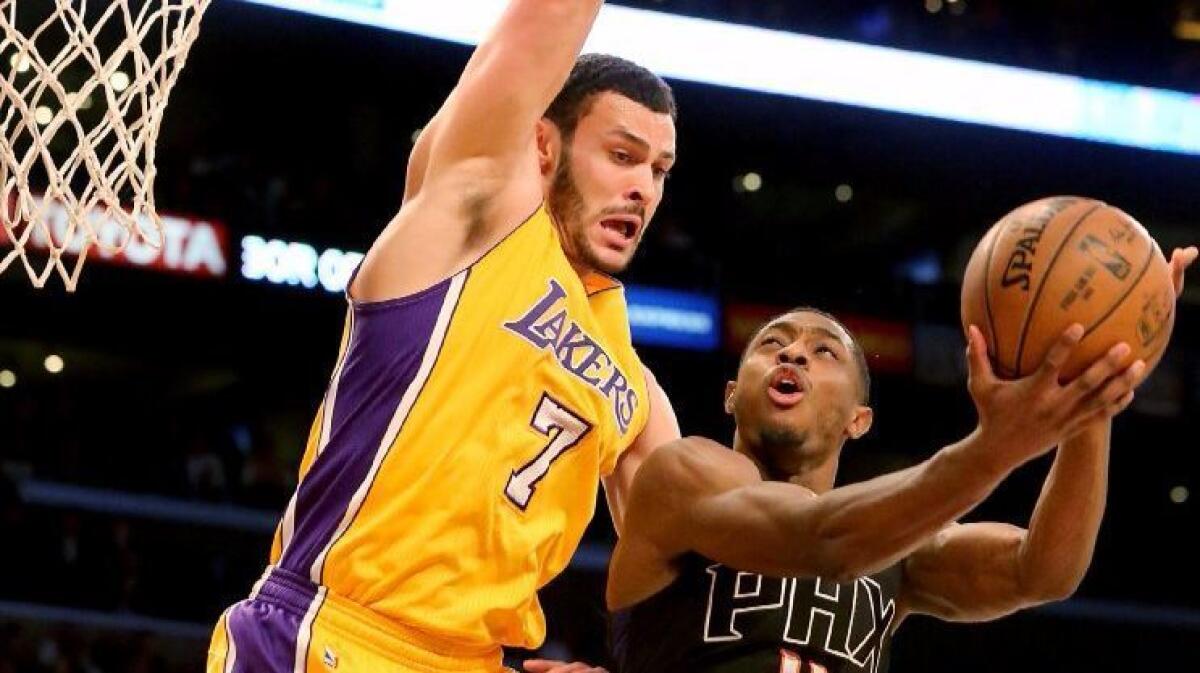 Lakers forward Larry Nance Jr. defends against Suns guard Brandon Knight during the first quarter of a game on Dec. 9.