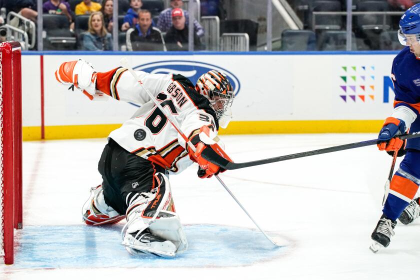 Ducks goaltender John Gibson can't prevent a goal from the Islanders' Oliver Wahlstrom in the second period Oct. 15, 2022.