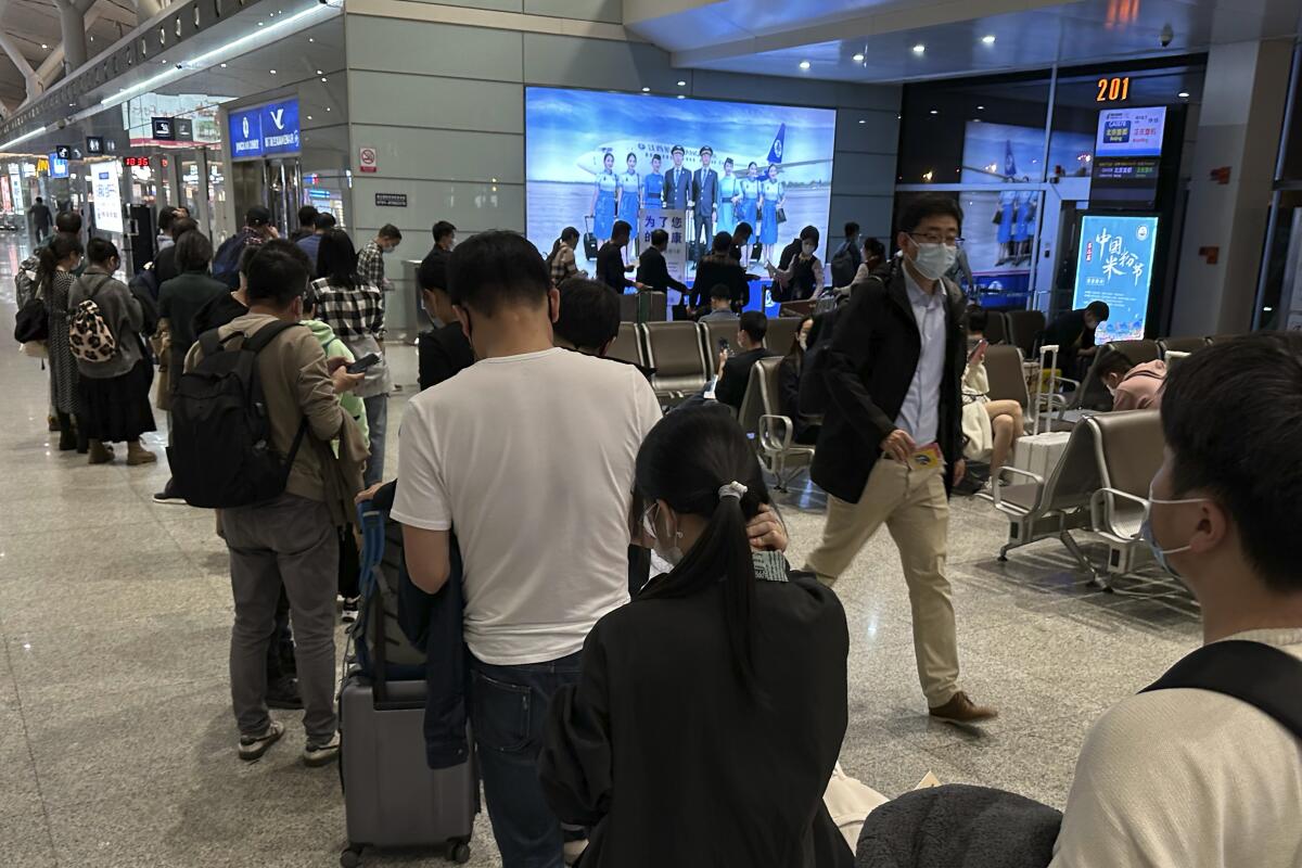 Passengers prepare to board a flight at the airport in China's Jiangxi province.