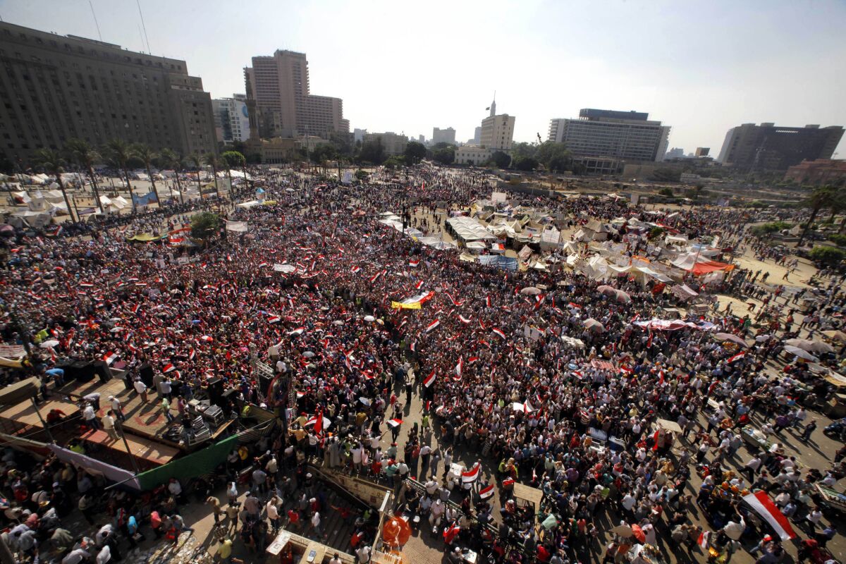 Opponents of Egyptian President Mohammed Morsi shout slogans during a protest in Tahrir Square in Cairo on Wednesday.