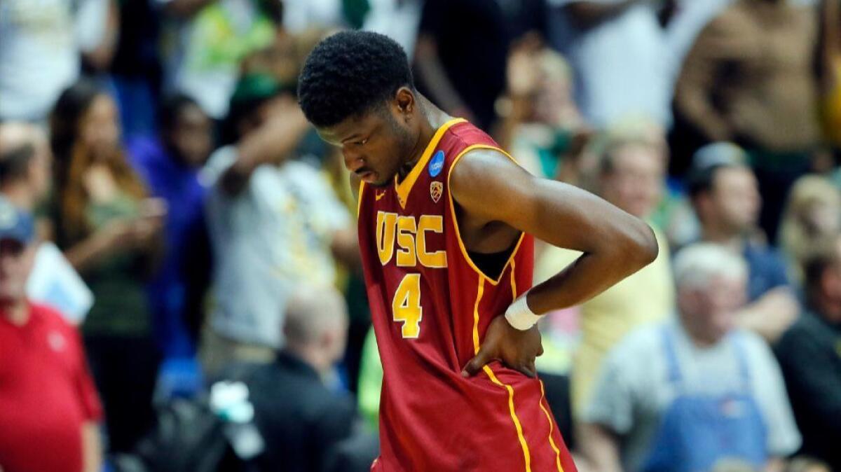 USC forward Chimezie Metu walks off the court after the Trojans' 82-78 loss to Baylor in a second-round game of the NCAA tournament on March 19 in Tulsa, Okla.