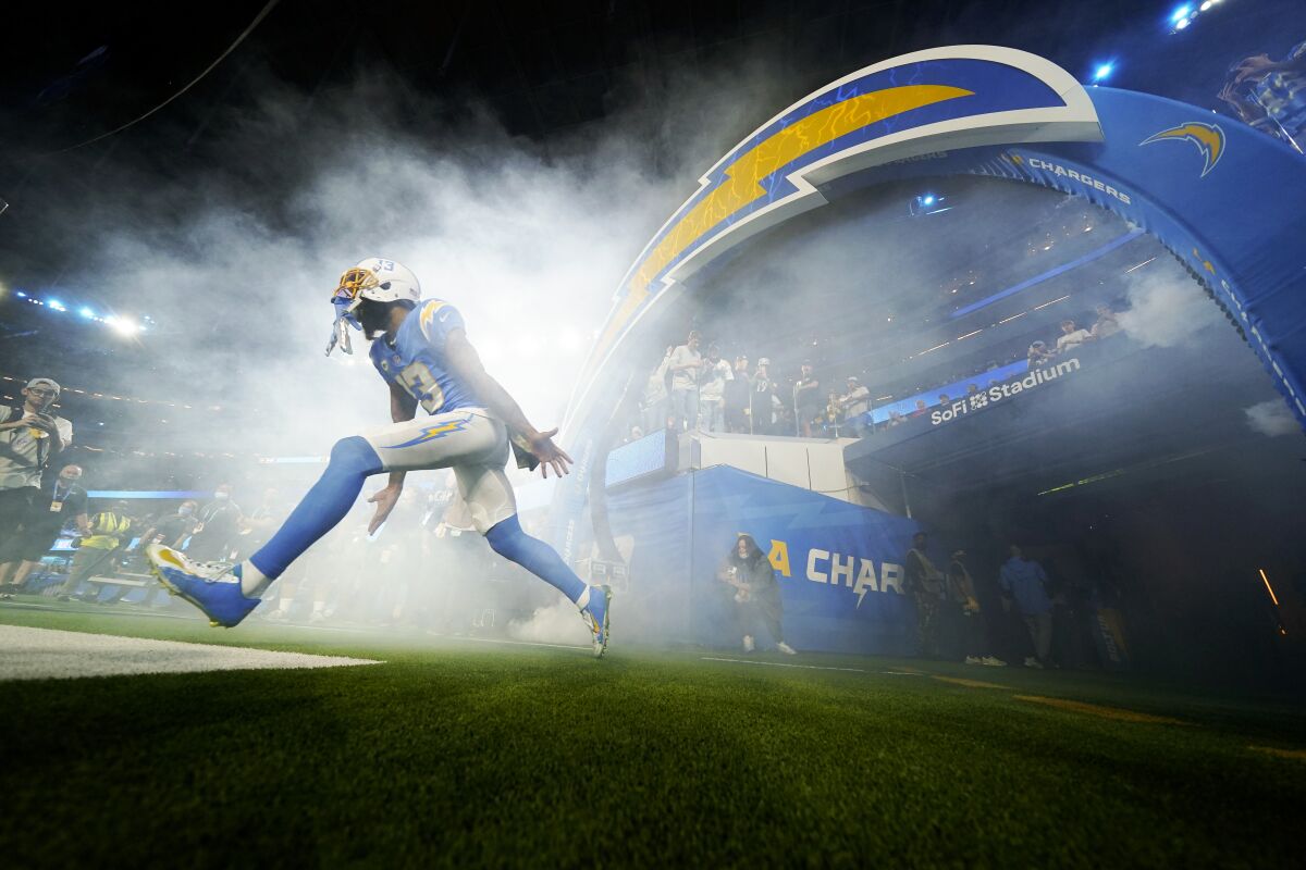 Chargers wide receiver Keenan Allen runs onto the field at SoFi Stadium before a win over the Pittsburgh Steelers.