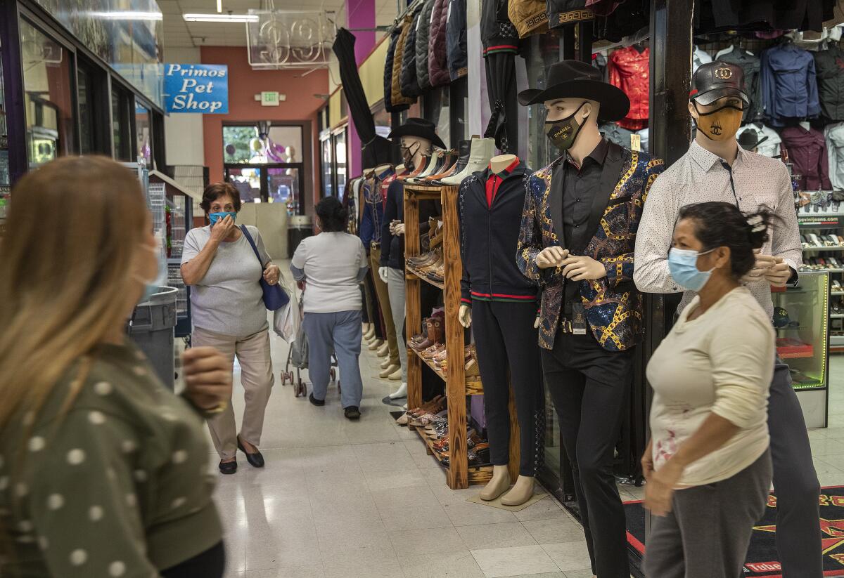 Shoppers on Monday at Plaza Mexico, a mall in Lynwood. 