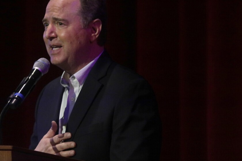 A man stands at a podium giving a speech. 