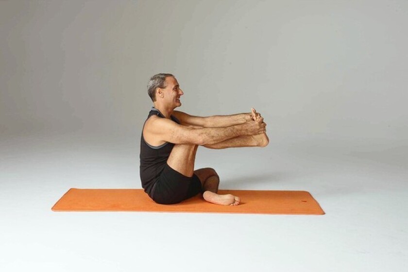 Sit cross-legged on a padded surface or a mat. Bring your right knee toward your chest and hold the sole of your right foot with both hands. Inhale, sit up tall and move your knee toward your chest without rounding your back or collapsing forward. Pause for a few breaths while feeling a stretch in the back of your right thigh.