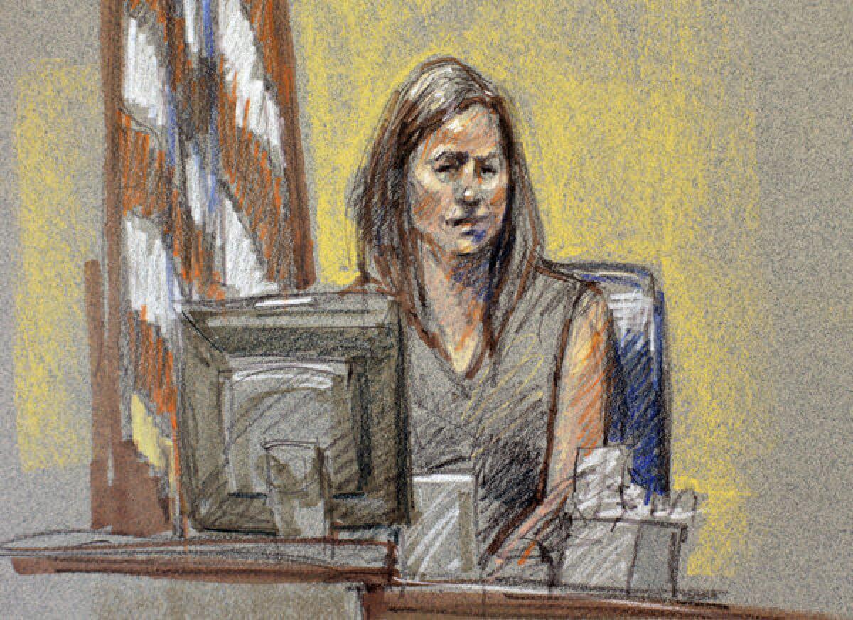 In this courtroom sketch, Angela Rivera, wife of Maj. L. Eduardo Caraveo -- one of 13 people killed in the Ft. Hood shootings, testifies Monday, part of the sentencing phase of Maj. Nidal Malik Hasan's court martial.
