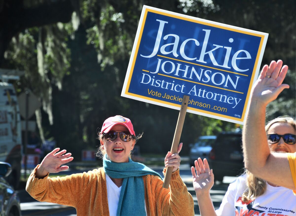 FILE - In this Tuesday, Nov. 3, 2020 file photo, District Attorney Jackie Johnson campaigns for reelection on St. Simons Island, Ga. Johnson, a former Georgia prosecutor was indicted Thursday, Sept. 2, 2021 on misconduct charges alleging she used her position to shield the men who chased and killed Ahmaud Arbery from being charged with crimes immediately after the shootings. (Terry Dickson/The Brunswick News via AP, File)