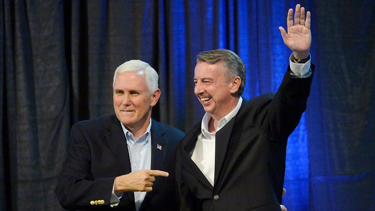 Vice President Mike Pence points to GOP gubernatorial candidate Ed Gillespie of Virginia during a campaign rally Saturday in Abingdon, Va.