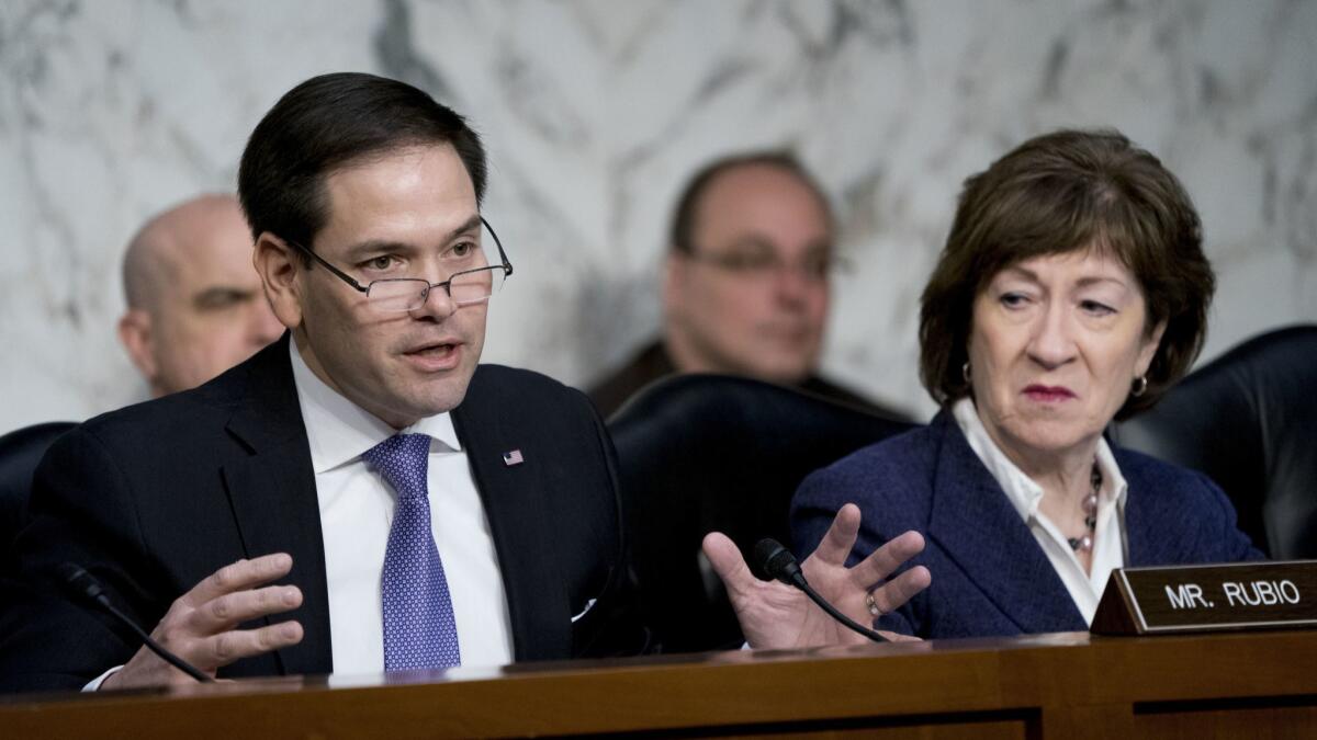 Sen. Marco Rubio, R-Fla., left, next to Sen. Susan Collins, R-Maine, right, on March 21.