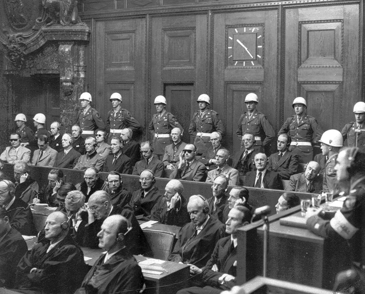 Alfred Rosenberg, head bowed, sits sixth from the left in the row second from the top, at the Nuremberg trials on Sept. 30, 1946, as partial verdicts are read. He was executed on Oct. 16.