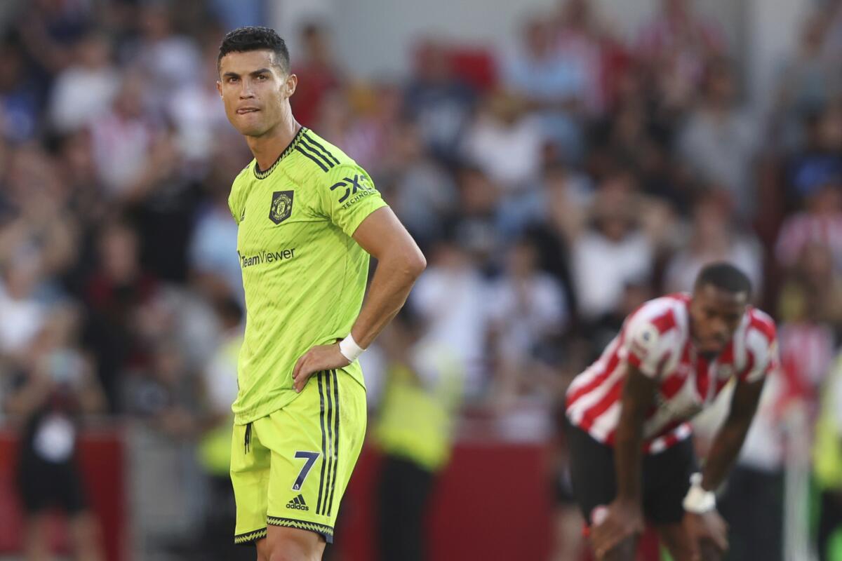 Manchester United's Cristiano Ronaldo looks round after the end of the English Premier League soccer match between Brentford and Manchester United at the Gtech Community Stadium in London, Saturday, Aug. 13, 2022. Manchester United lost 0-4 .(AP Photo/Ian Walton)