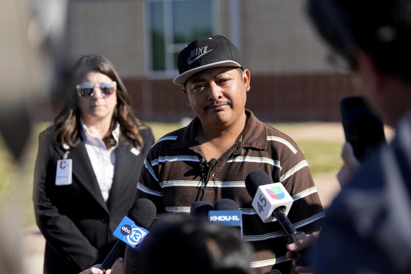 Mass shooting survivor Wilson Garcia talks to the media after a vigil for his son, Daniel Enrique Laso, Sunday, April 30, 2023, in Cleveland, Texas. Garcia's son and wife were killed in the shooting Friday night. The search for a Texas man who allegedly shot his neighbors after they asked him to stop firing off rounds in his yard stretched into a second day Sunday, with authorities saying the man could be anywhere by now. The suspect fled after the shooting Friday night that left multiple people dead, including the young boy. (AP Photo/David J. Phillip)