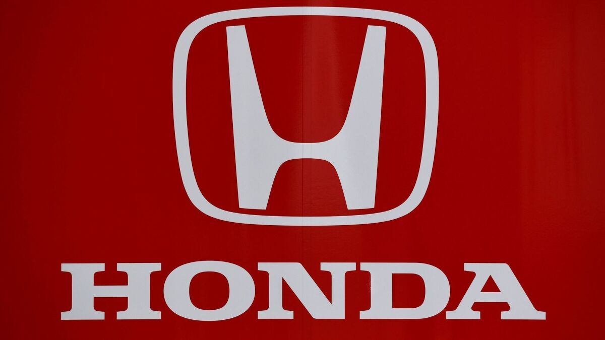 The logo of Japanese automobile manufacturer Honda is seen at the Autodromo Nazionale circuit in Monza. General Motors and Honda have joined forces with the tech firm Cruise to develop autonomous vehicles as the race to market self-driving cars continues.