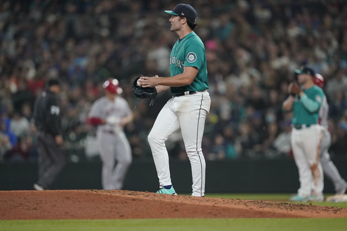 Seattle Mariners starting pitcher Robbie Ray stands on the mound after he gave up a single to Los Angeles Angels' Max Stassi that broke up his no-hitter during the seventh inning of a baseball game, Friday, June 17, 2022, in Seattle. (AP Photo/Ted S. Warren)