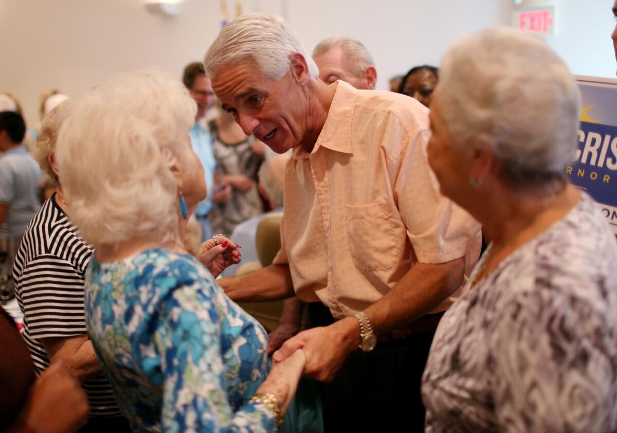 Charlie Crist, the Democratic candidate for governor in Florida, greets people at a campaign event at the Century Village Pembroke Pines Jewish Center on Oct. 30.