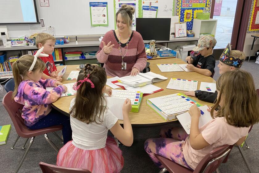 Barnett Elementary Reading Intervention Teacher Kaylene Weber guides reading instruction with students in the W.I.N. program.