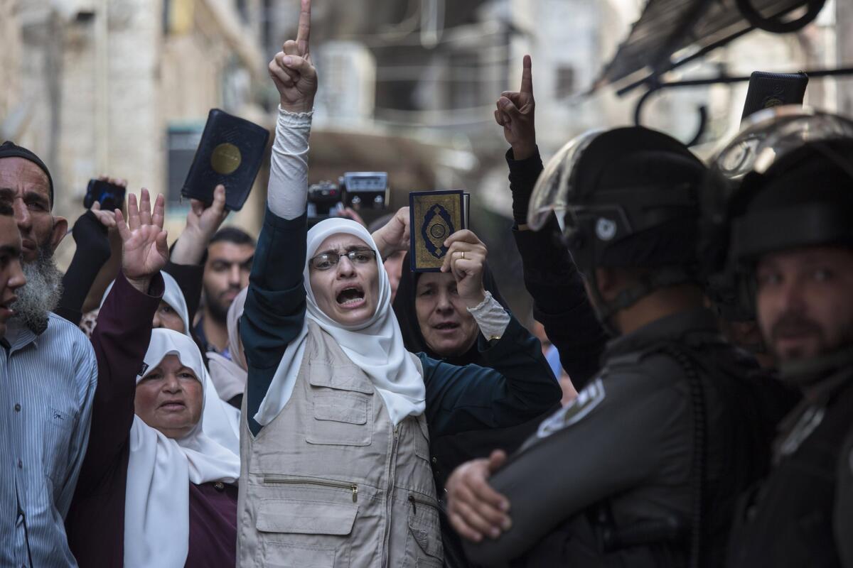 Palestinians chant slogans during a protest in Jerusalem's Old City on Sunday.