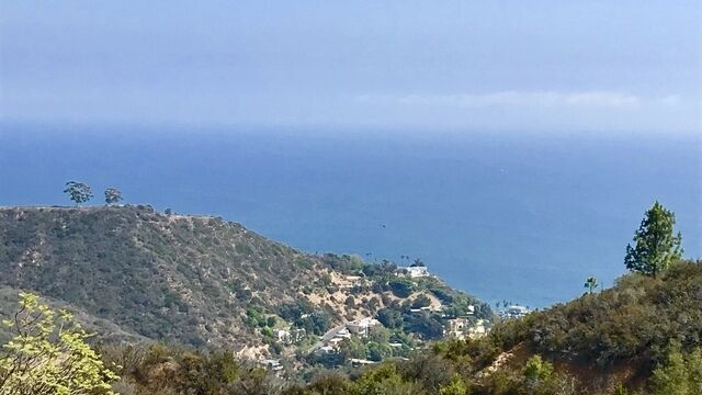The unimproved ocean-view site in Malibu totals more than three acres.