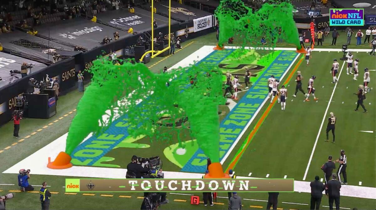 Virtual slime cannons go off in the end zone after a touchdown during Nickelodeon's kid-focused broadcast of the NFL wild-card playoff game between the Chicago Bears and New Orleans Saints at the Superdome, Sunday, Jan. 10, 2021 in New Orleans. The positive reviews for Nickelodeon's kids-focused broadcast of last Sunday's NFL playoff game showed the potential of alternate broadcasts of sporting events. The success of that broadcast has led to many wondering what other sports it could expand to and when we might see it again in the NFL? (CBS/Viacom via AP)