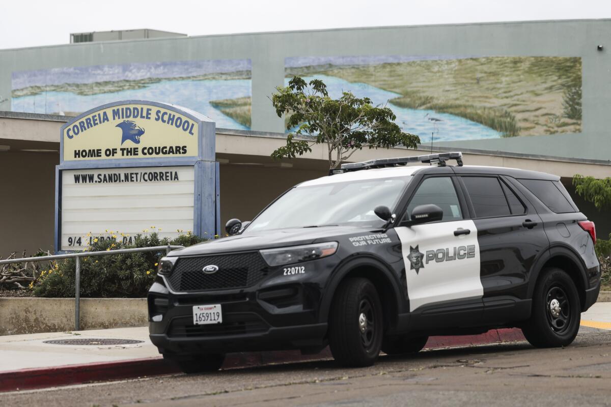 A police vehicle is parked outside Correia Middle School in Point Loma on Sept. 5.