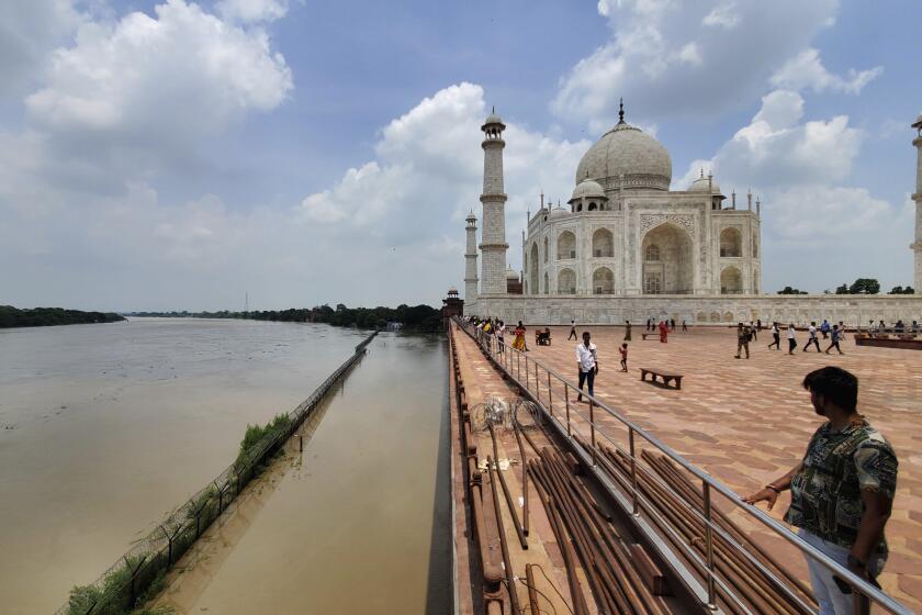 CORRECTS DATE- A swollen Yamuna river rises to the periphery of the Taj Mahal monument in Agra, India, Tuesday, July 18, 2023. (AP Photo/Aryan Kaushik)