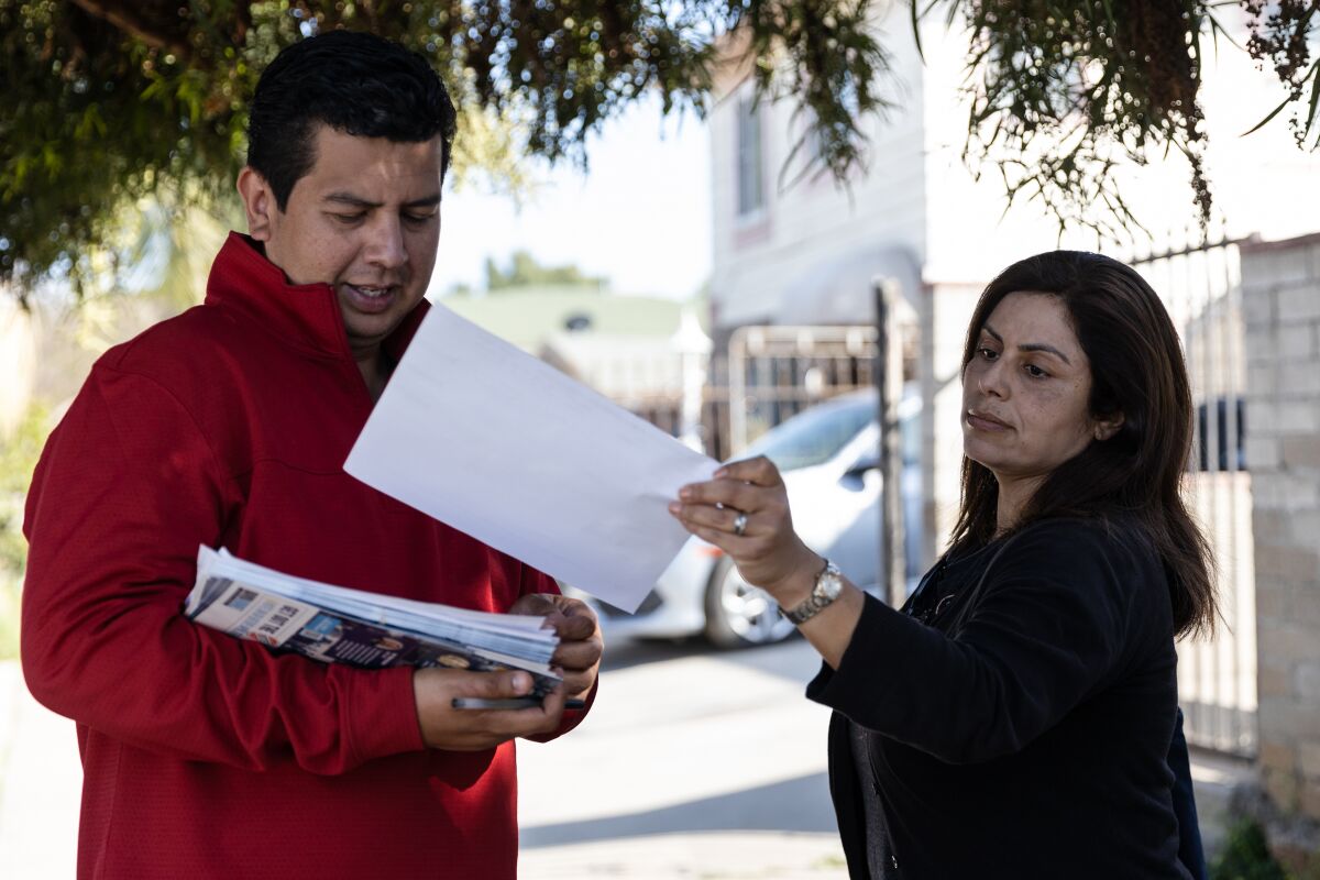 Candidate David Alvarez and his wife, Xochitl, canvassing in the Barrio Logan neighborhood 