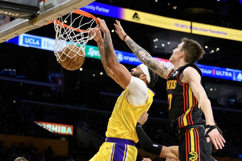 LOS ANGELES, CA - MARCH 18, 2024: Los Angeles Lakers forward Anthony Davis (3) scores.