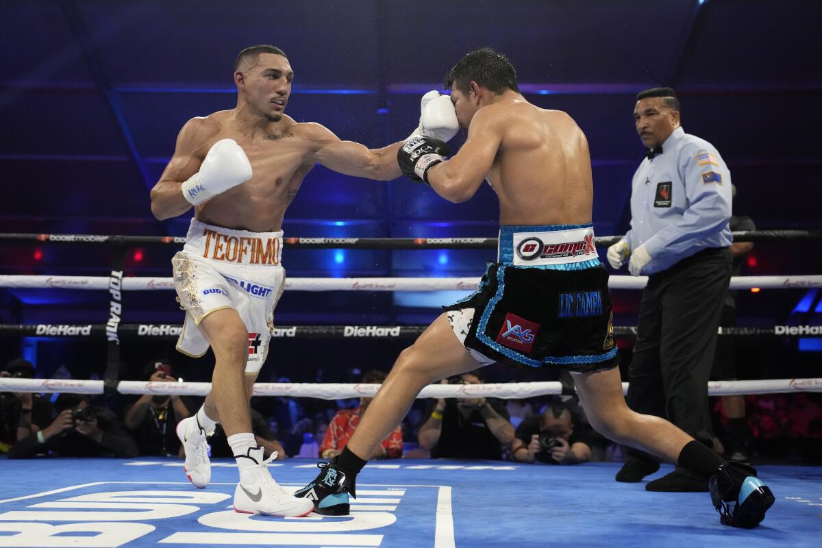 Teofimo Lopez hits Pedro Campa in a junior welterweight boxing match, Saturday, Aug. 13, 2022, in Las Vegas. (AP Photo/John Locher)