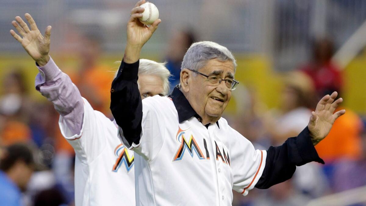 Felo Ramirez, Cuban American Spanish language radio announcer, waves to the crowd before throwing out a ceremonial pitch before a baseball game between the Marlins and Detroit Tigers in 2013.