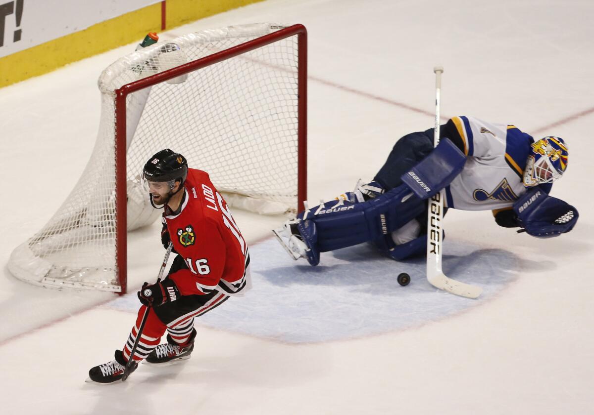 Blackhawks left wing Andrew Ladd (16) misses a penalty shot against Blues goalie Brian Elliott (1) during the third period on Apr. 7.