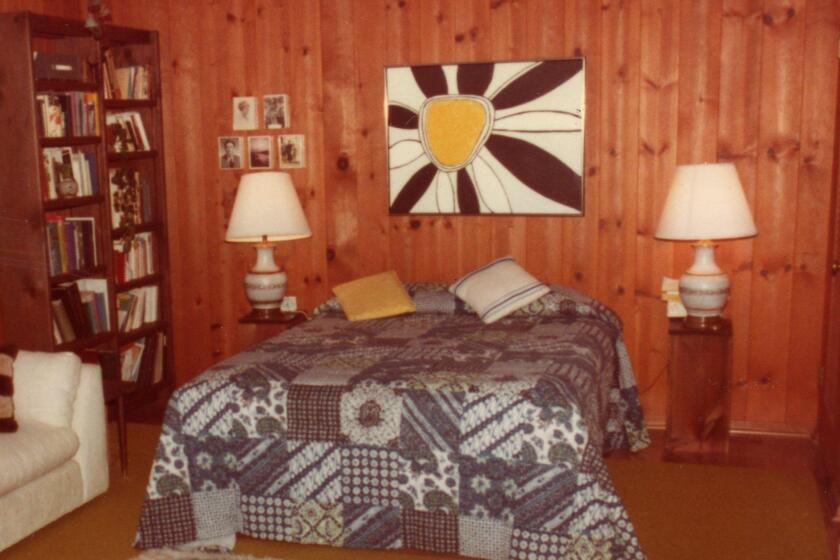 While going through a photo album recently, I came across a picture of our guest room in 1977 with the daisy picture hanging over the bed.