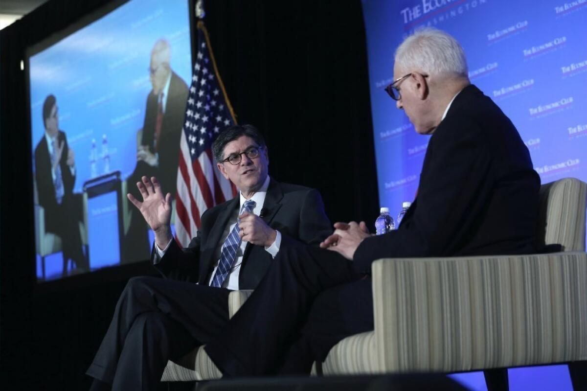 Treasury Secretary Jacob J. Lew, left, talks about the budget at a Washington forum.