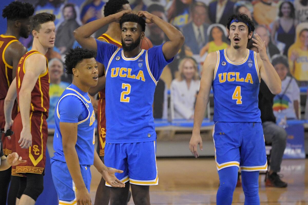 From left, UCLA's Jaylen Clark, Cody Riley and Jaime Jaquez Jr. react to a foul call March 6, 2021.