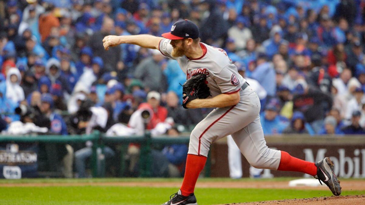 Stephen Strasburg strikes out 12 batters in seven innings to beat the Chicago Cubs and carry the Washington Nationals to a fifth and decisive game in a National League division series.