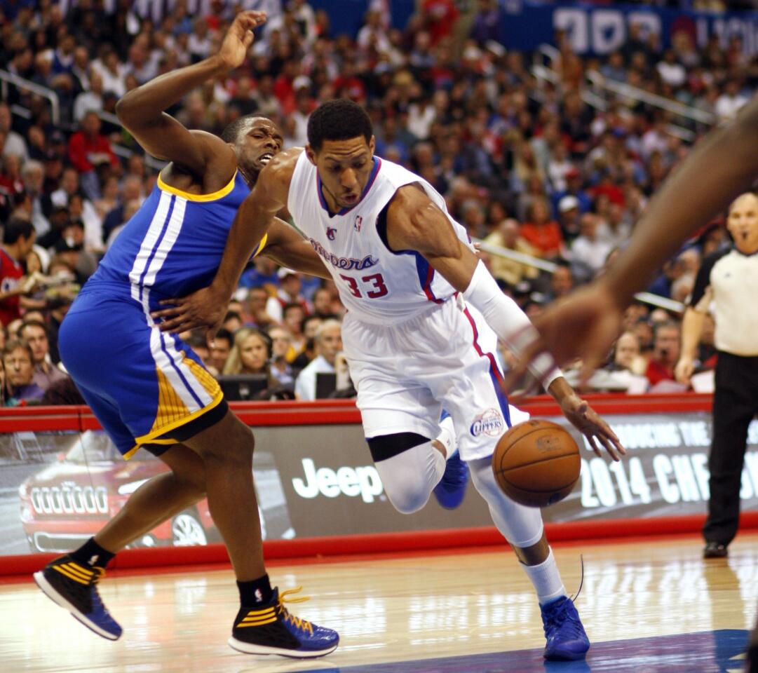 Clippers small forward Danny Granger, right, drives past Golden State Warriors small forward Andre Iguodala during the second half of the Clippers' 111-98 win at Staples Center.