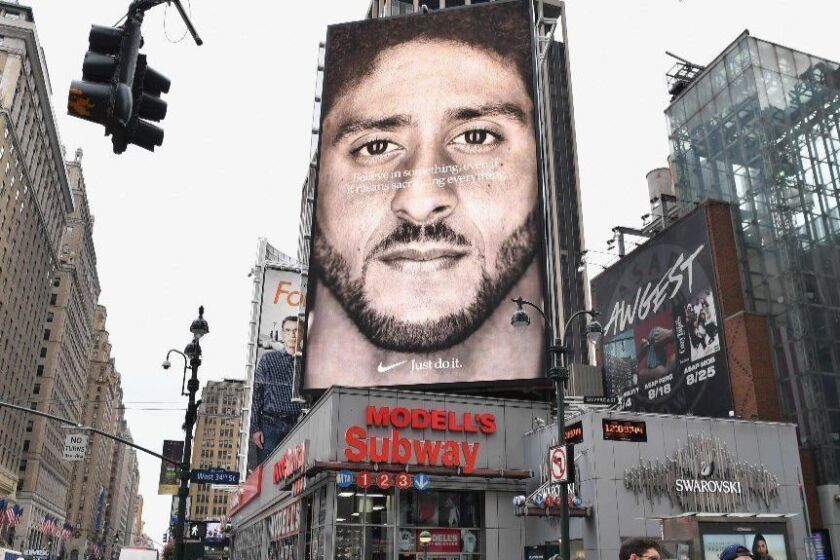 (FILES) In this file photo taken on September 08, 2018 a Nike Ad featuring American football quarterback Colin Kaepernick is on diplay in New York City. - Nike withdrew a shoe displaying an early version of the American flag after former NFL quarterback Colin Kaepernick warned the design was associated with slavery, US media reported on July 1, 2019. (Photo by Angela Weiss / AFP)ANGELA WEISS/AFP/Getty Images ** OUTS - ELSENT, FPG, CM - OUTS * NM, PH, VA if sourced by CT, LA or MoD **
