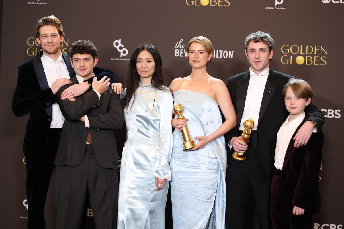 Joe Alwyn, Noah Jupe, Chloé Zhao, Jessie Buckley, Paul Mescal and Jacobi Jupe backstage at the Golden Globes.