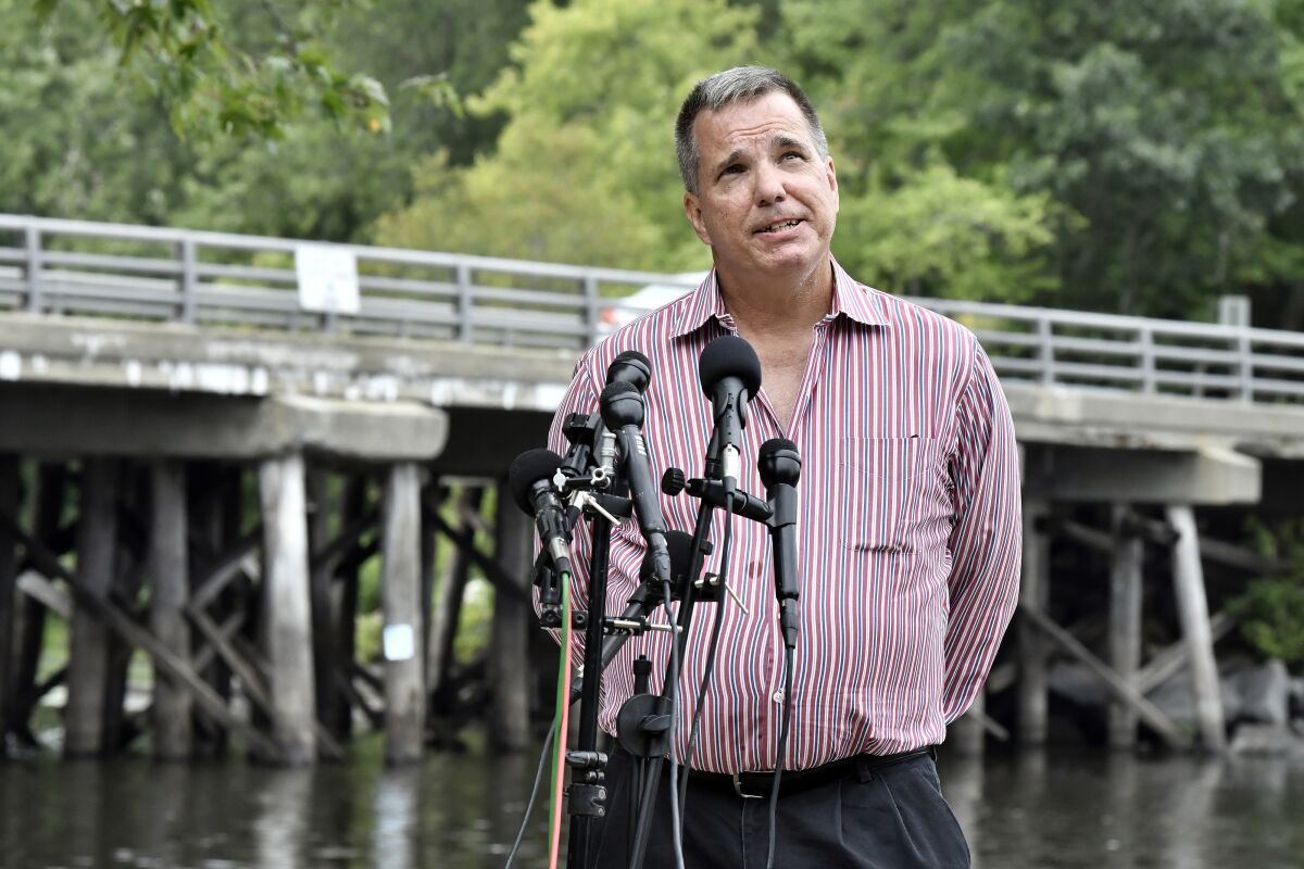 Joe Desiato, whose son U.S. Marine Lance Cpl. Travis Desiato was killed in 2004, speaks to reporters Thursday, Sept. 10, 2020, in Bedford, Mass. The families of two servicemen from Bedford, Mass., killed in action in Iraq addressed reports of President Trump's statement on military service by the bridge named as a memorial to their sons. (AP Photo/Josh Reynolds)