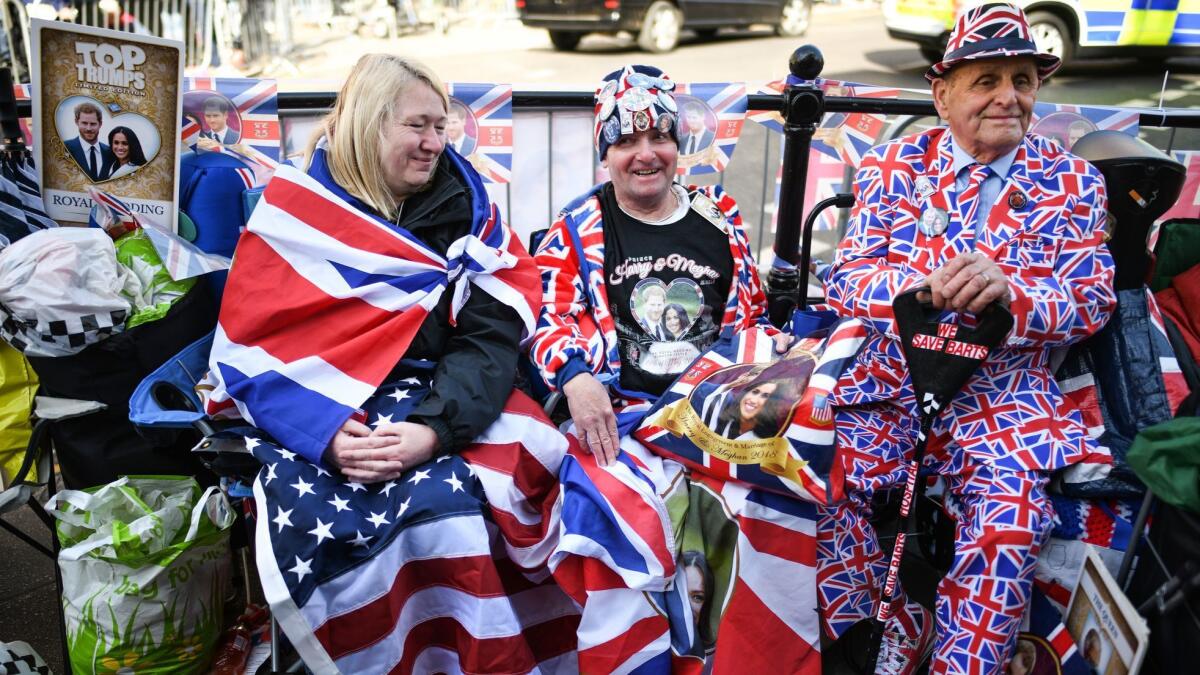 People await the rehearsal of the carriage procession for the wedding of Prince Harry and Meghan Markle on May 17, 2018, in Windsor, England.
