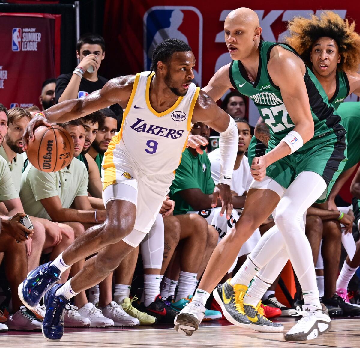 Lakers' Bronny James dribbles the ball during a Summer League game against the Celtics
