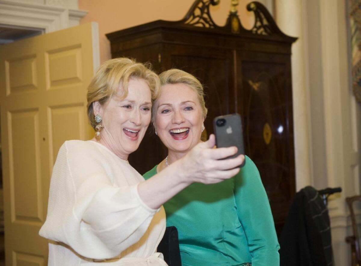 Actress Meryl Streep uses her iPhone to take a selfie of her and then-Secretary of State Hillary Rodham Clinton following a gala in Washington.