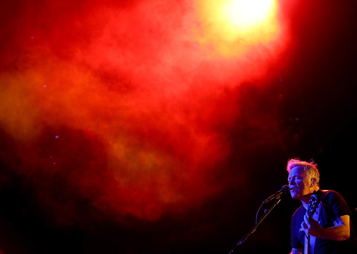 Guitarist/singer Bernard Sumner fronts New Order during a performance at the Greek Theatre in Los Angeles on July 13.