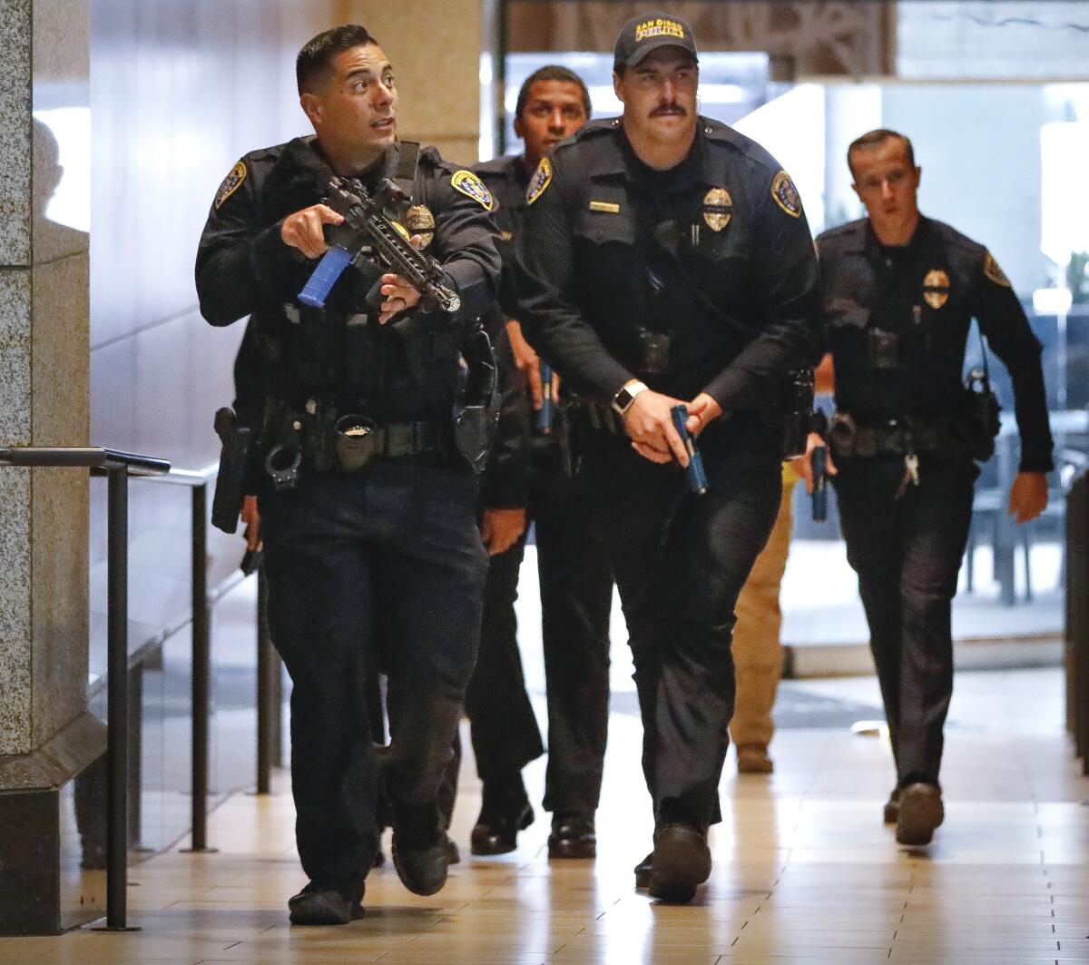 San Diego police officers enter the Westin San Diego Hotel in downtown San Diego on Aug. 17, 2019.