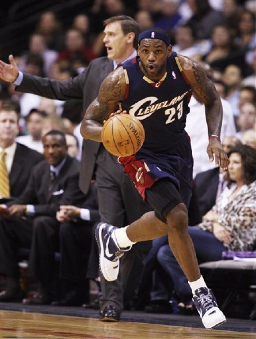 Cleveland Cavaliers Lebron James brings the ball up the court on a fast-break against Dallas Mavericks during the first half in an NBA basketball game, Monday, Nov. 3, 2008 in Dallas. (AP Photo/Tim Sharp)