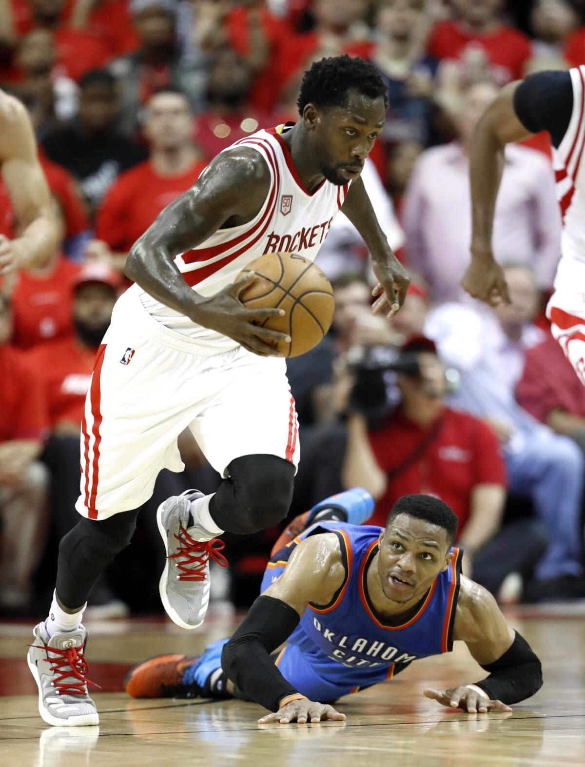 Patrick Beverley races away with the ball after stealing it from Russell Westbrook, who was left on the floor.