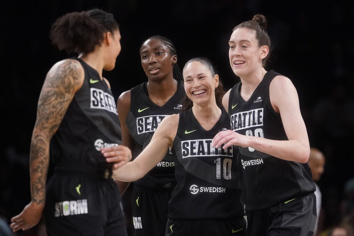 Seattle Storm guard Sue Bird (10) celebrates with teammates after scoring a 3-point goal during the final seconds of the second half of a WNBA basketball game against the New York Liberty, Sunday, June 19, 2022, in New York. (AP Photo/Mary Altaffer)