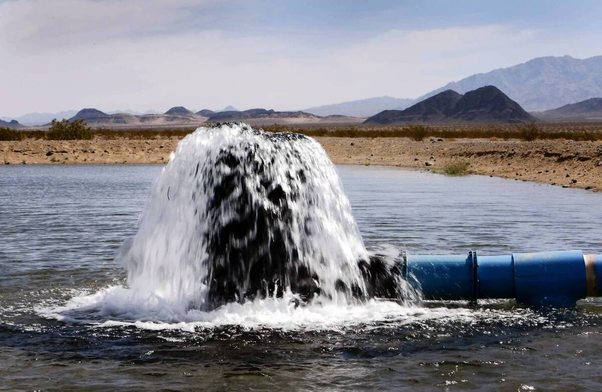 Water pours out into a spreading basin which holds water from pilot well number 1 used for testing and is part of a possible water storage component on Cadiz Ranch. Cadiz Inc. hopes to build a conveyance pipeline along railroad tracks to export groundwater from the Mojave Desert.