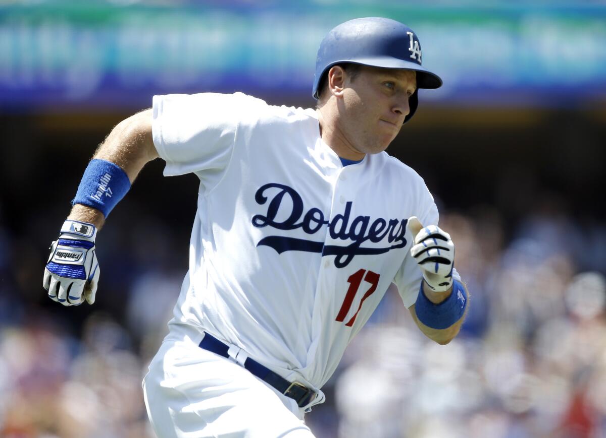 Los Angeles Dodgers' A.J. Ellis rounds first after he hits a run scoring single against the Boston Red Sox during the second inning of a baseball game in Los Angeles, Saturday, Aug. 6, 2016. (AP Photo/Alex Gallardo)